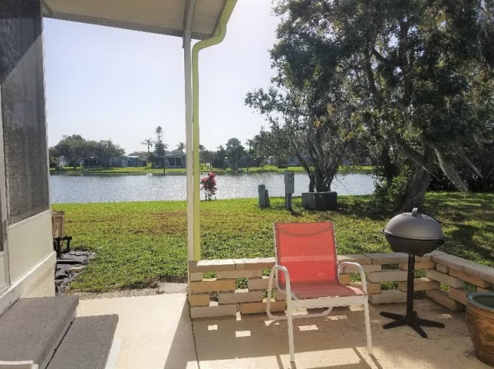 7415 Royal Crest Dr, Ellenton FL- Beautiful updated lake view home with two lanai's. 34